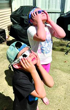 Pendleton County residents both stayed at home to view a 98.4 percent eclipse of the sun traveled a few miles to put themselves into the path of total solar eclipse.