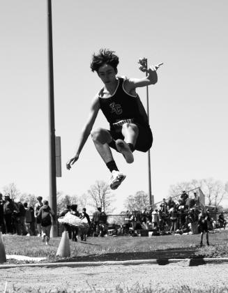 Wildcat Jamison Tucker goes airborne during his first place performance in the long jump competition. Photo courtesy of Beverly Beckett.